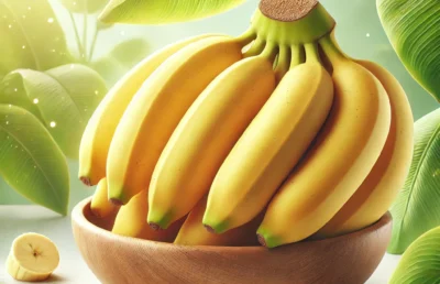 Fresh, ripe yellow bananas bunch against a white background, showcasing their perfect curved shape and vibrant color